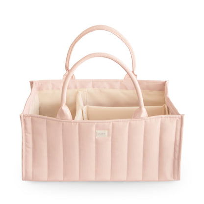 Pink fabric caddy with handles on a white background