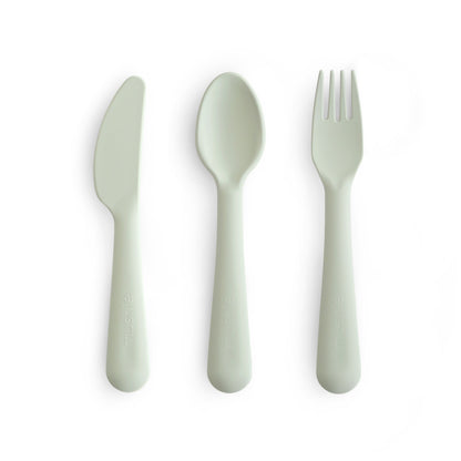 Set of green cutlery including a knife, spoon, and fork on a white background