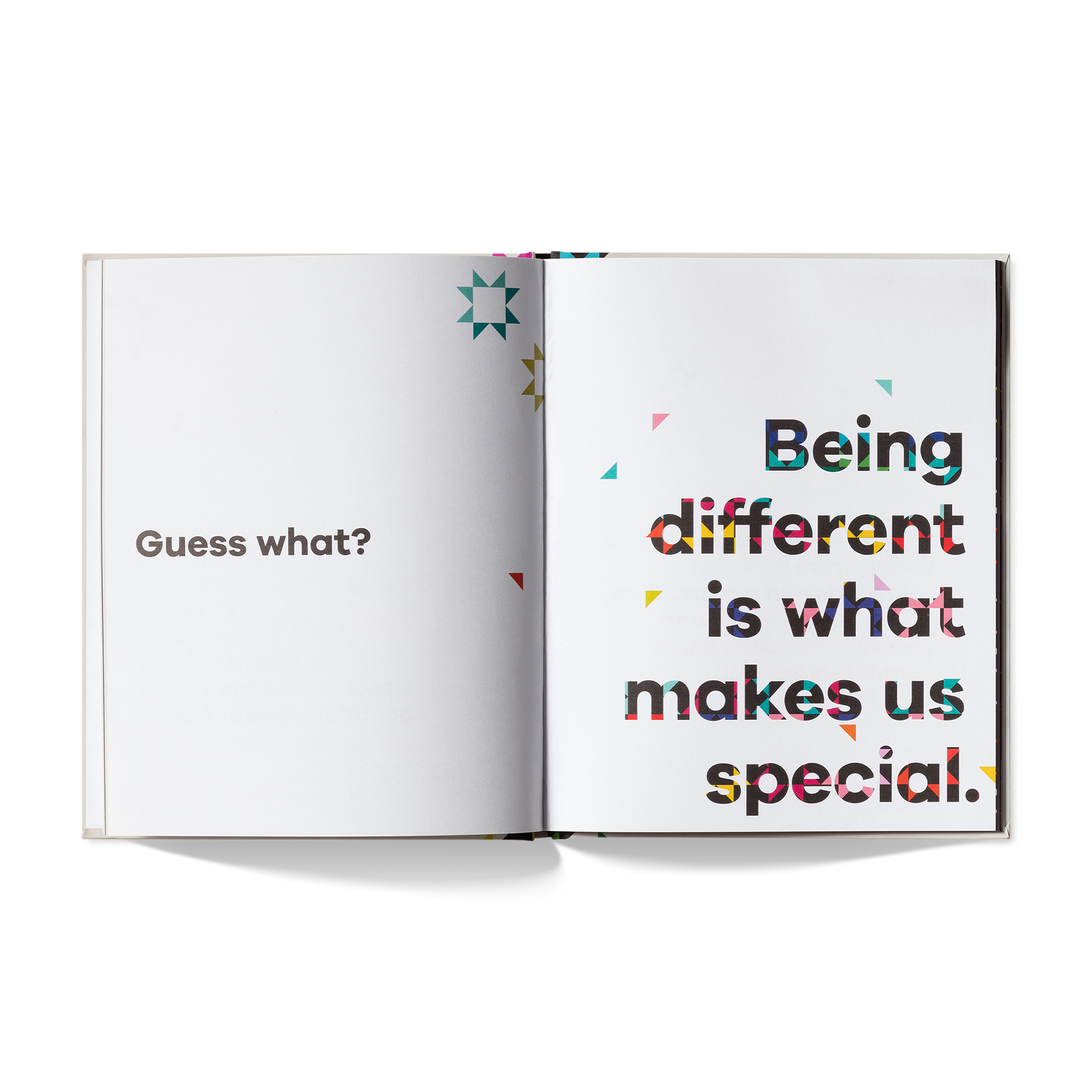Open book with text 'Guess what? Being different is what makes us special.' on a white background