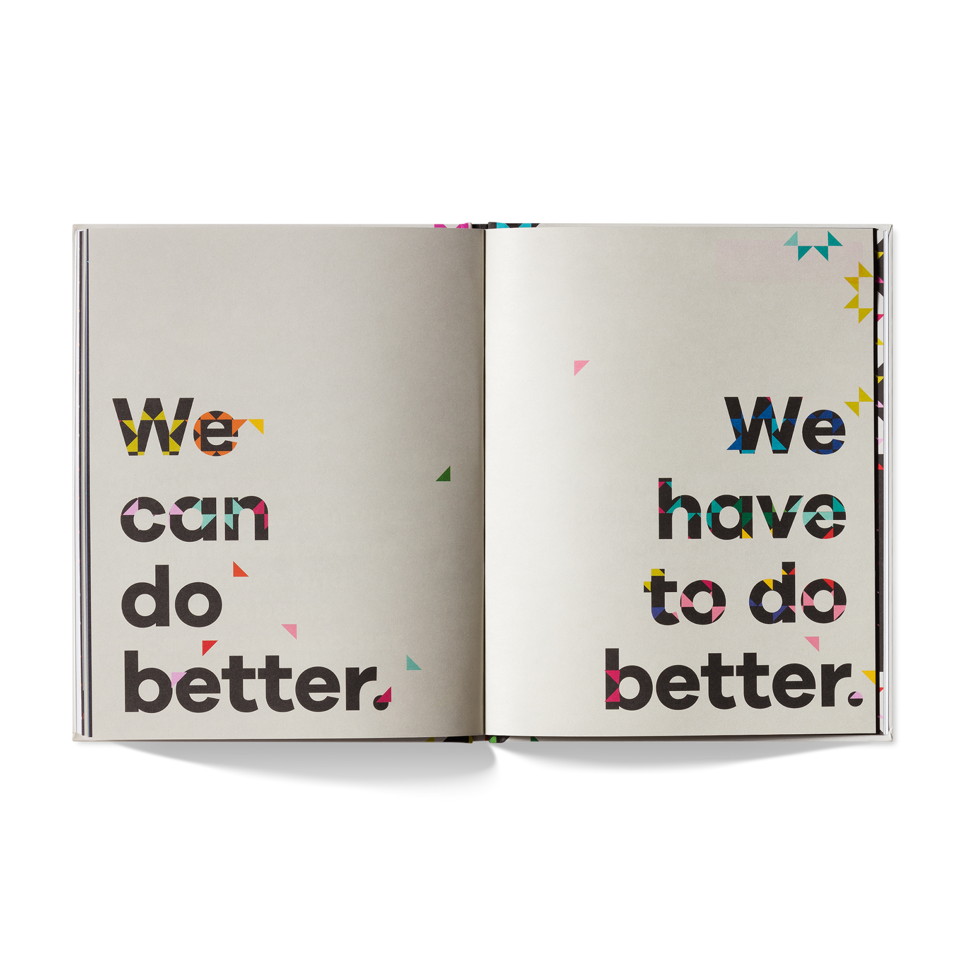 Open book with motivational text 'We can do better' and 'We have to do better' on a white background