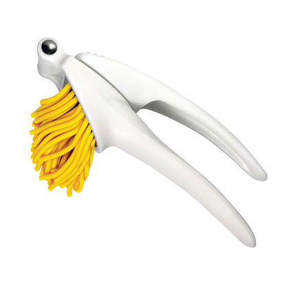 White kitchen tool with yellow bristle brush on a white background