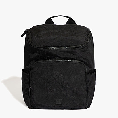 Black backpack on a light gray background