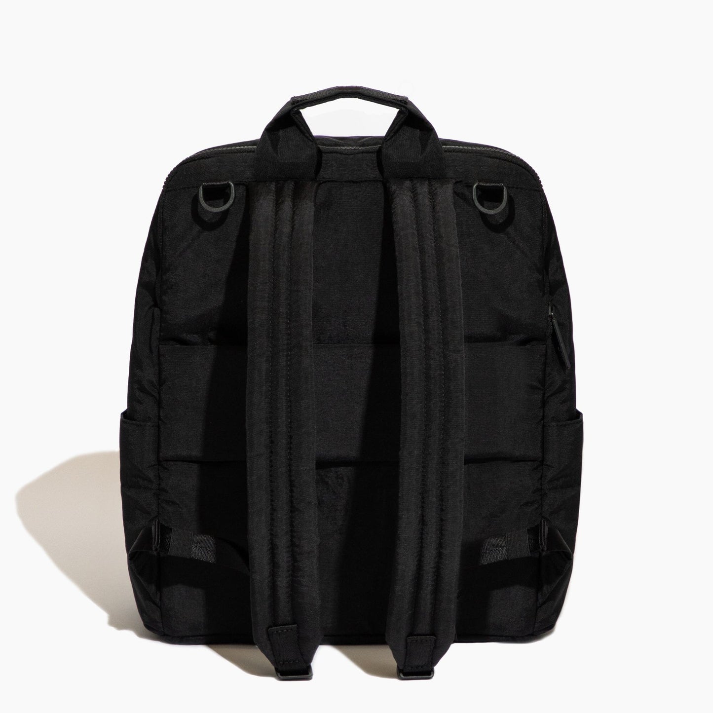 Black backpack shown from the back on a white background