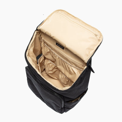 Black backpack with beige interior on a white background