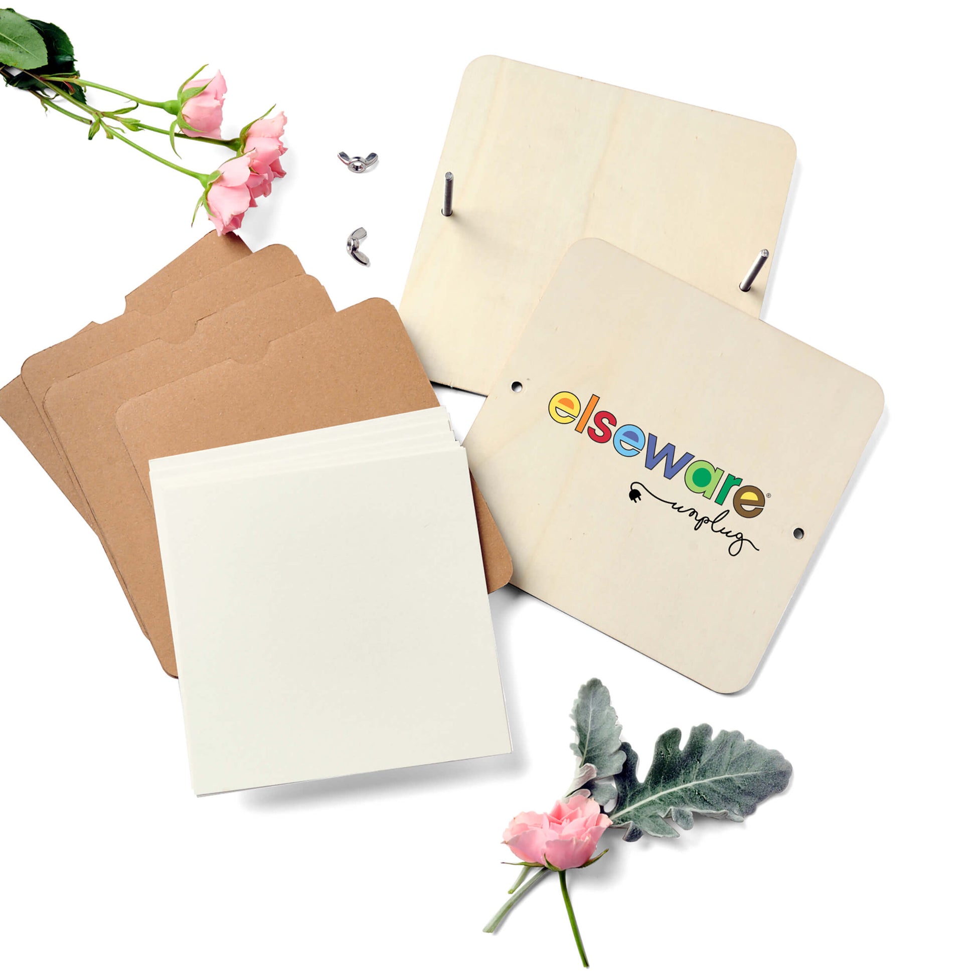 Set of notebooks with floral decorations on a white background, featuring the brand 'elseware'.