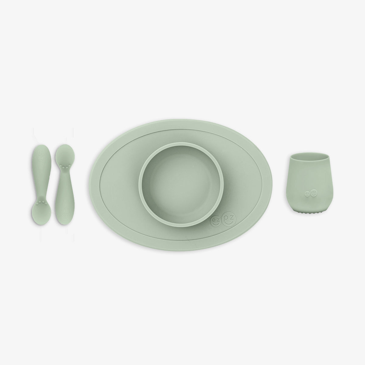 Mint green children's dinner set including bowl, cup, and utensils on a white background