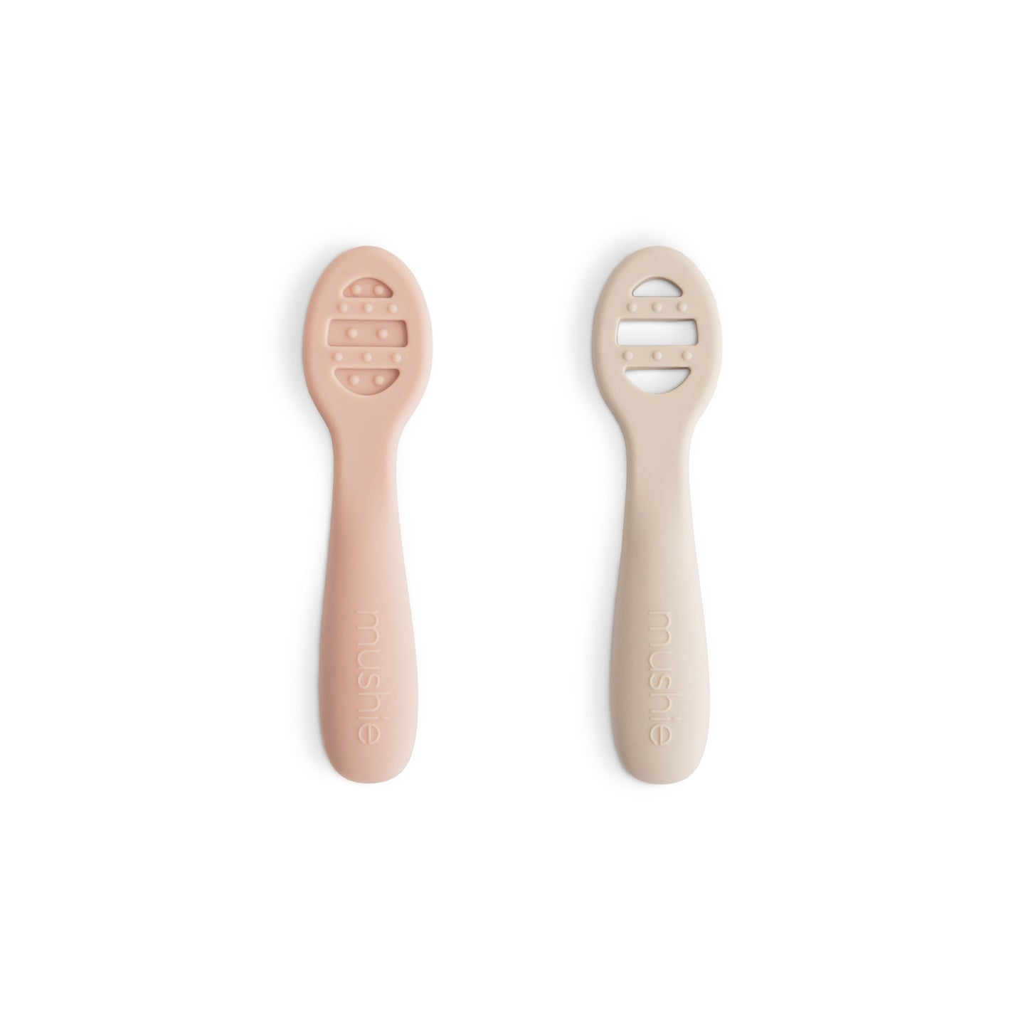 Two baby spoons with silicone handles on a white background