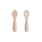Two baby spoons with silicone handles on a white background
