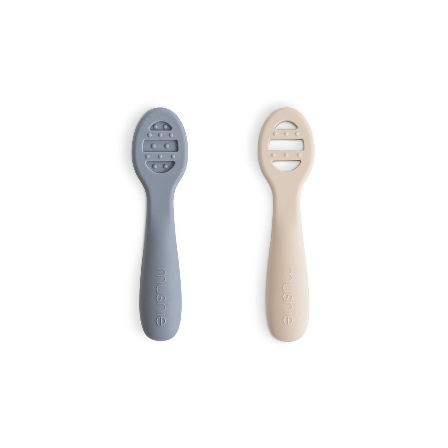 Two baby utensils, one gray and one beige, on a white background