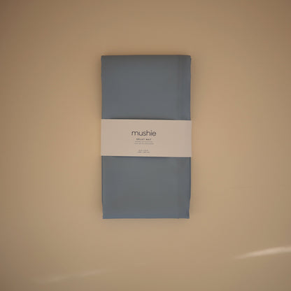 Gray package with a label on a beige background