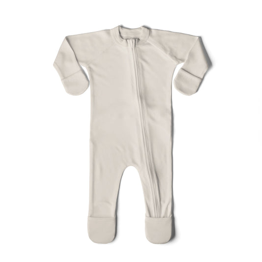 Beige baby onesie with a zipper on a white background