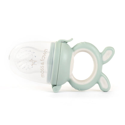 Mint green baby teether with 'moss & farrow' branding on a white background