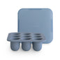 Blue silicone ice cube tray with lid on a white background