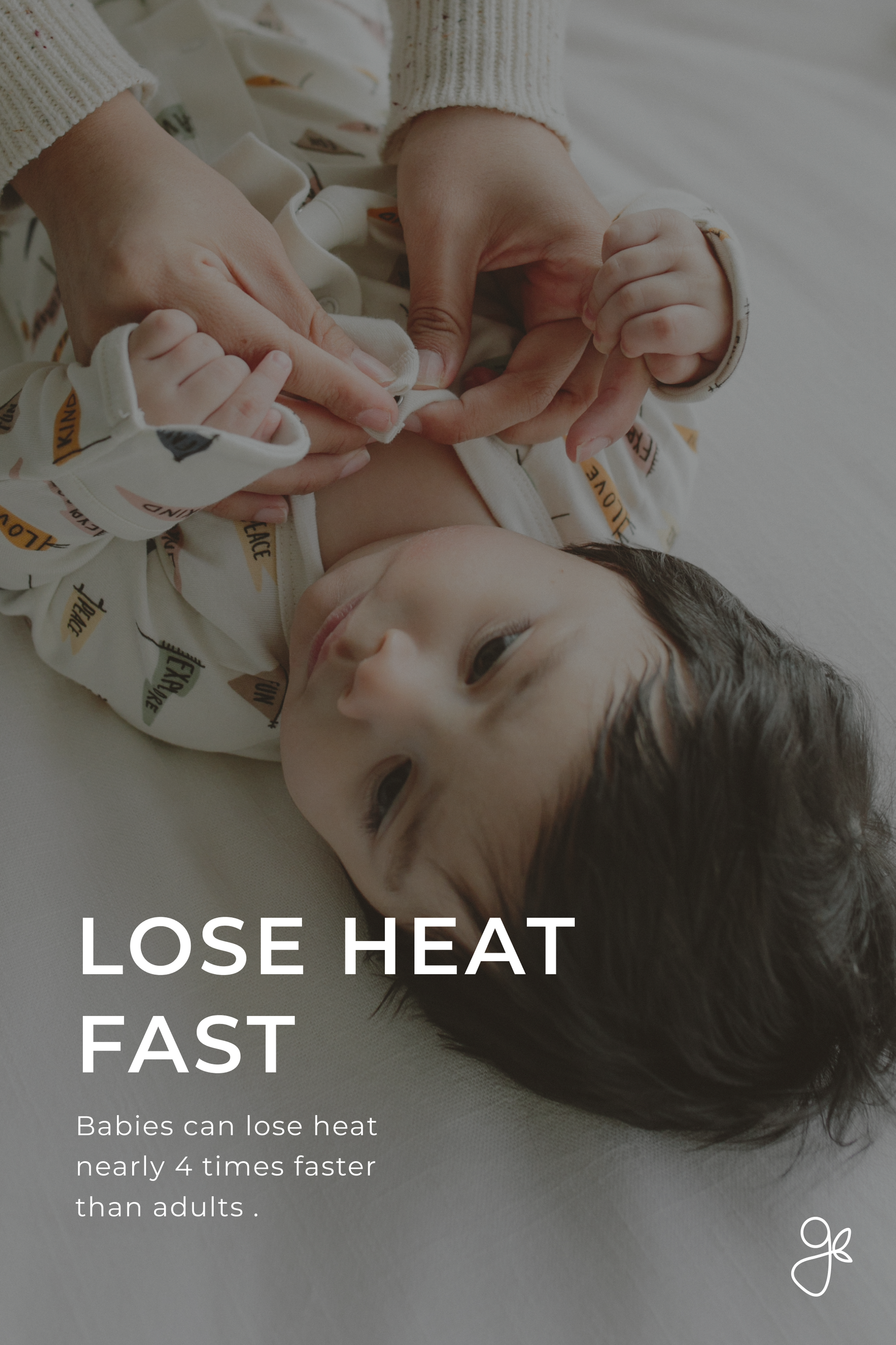 Baby lying on a white blanket with text about heat loss, shown from above.