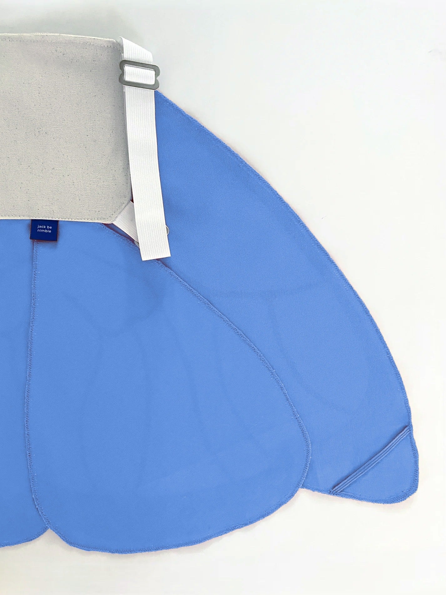 Blue saddle pad with a gray cover on a white background