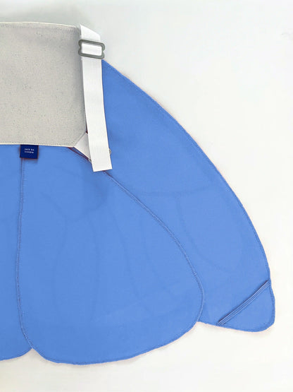 Blue saddle pad with a gray cover on a white background