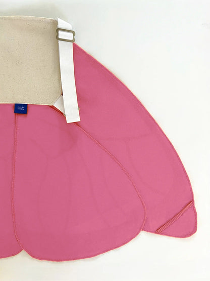 Pink skirt with beige waistband and white strap on a white background