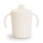 Beige sippy cup with handles on a white background