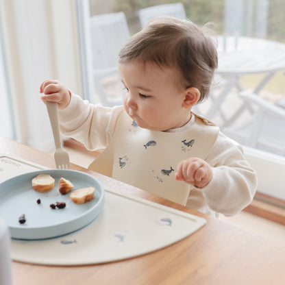 Mushie Silicone Baby Bib – Adjustable Catch-All