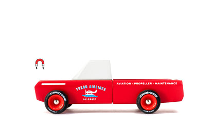 Red toy truck with white top and visible branding on a white background