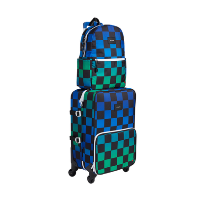 Stack of blue and green checkered luggage and backpack on a white background