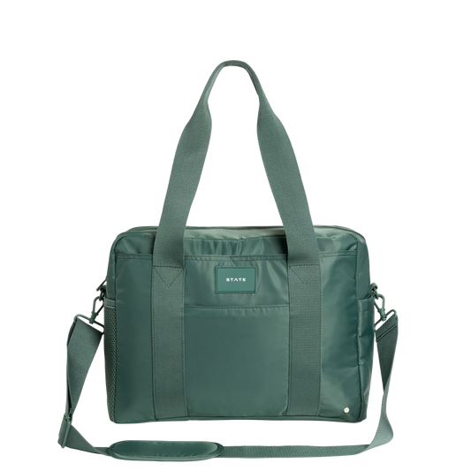 Green bag with a visible brand label on a white background
