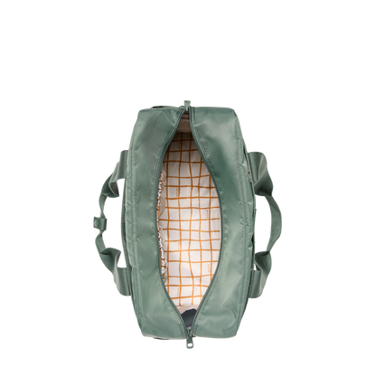 Green backpack with a checkered interior on a white background