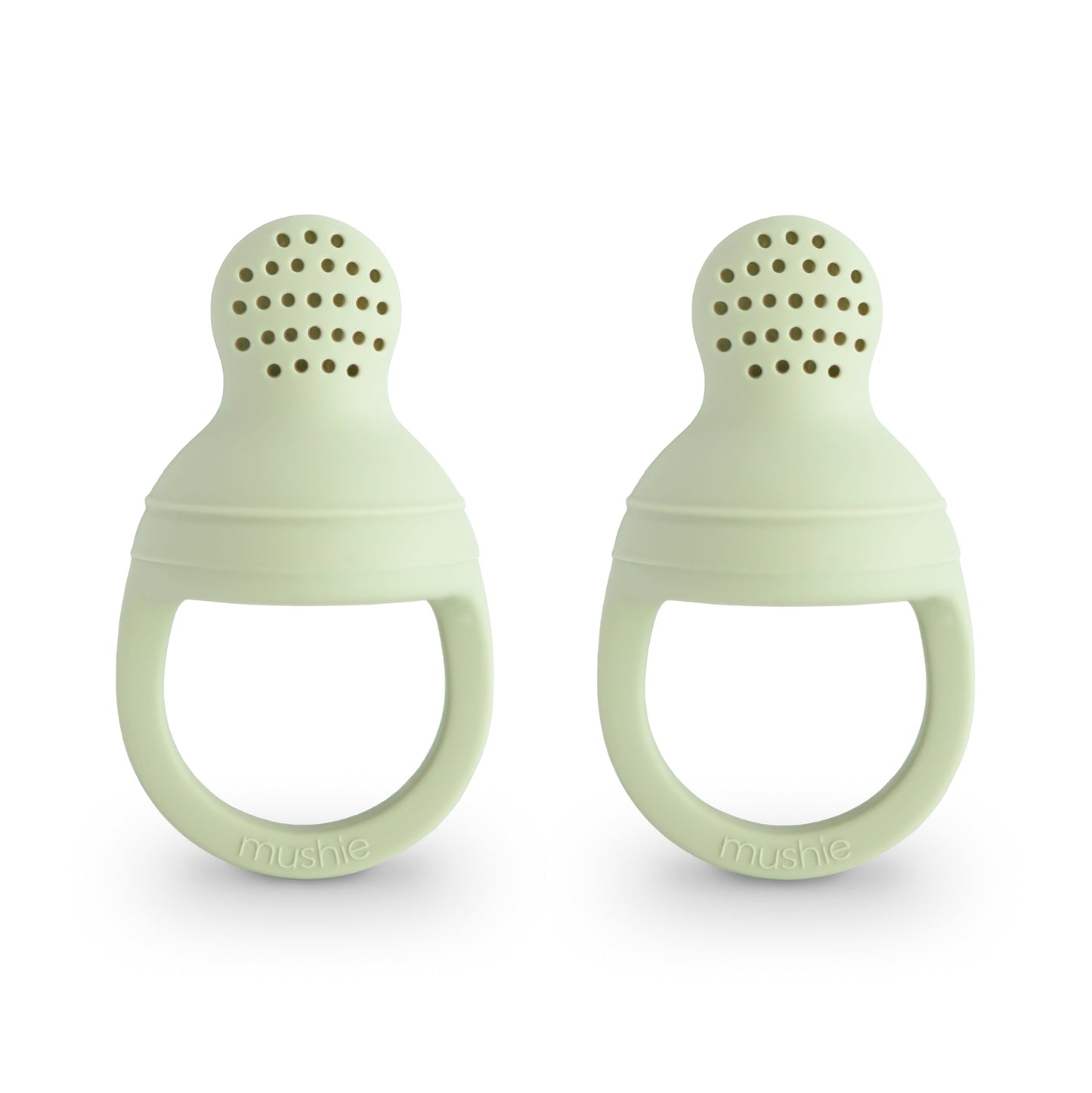 Two light green silicone teething rings on a white background