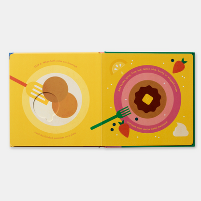 Illustrated book open to pages with donuts and a fork on a yellow background