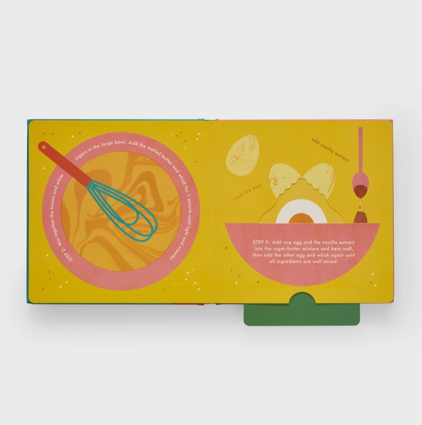 Children's book with colorful illustrations of kitchen items on a yellow background