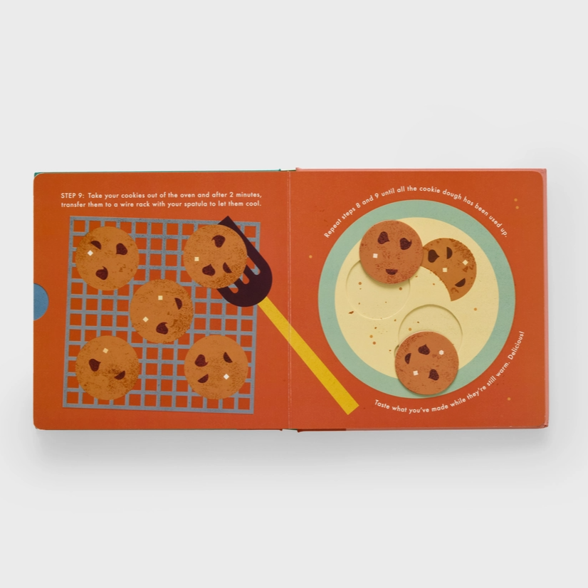 Children's book with illustrations of cookies and baking tools on a white background