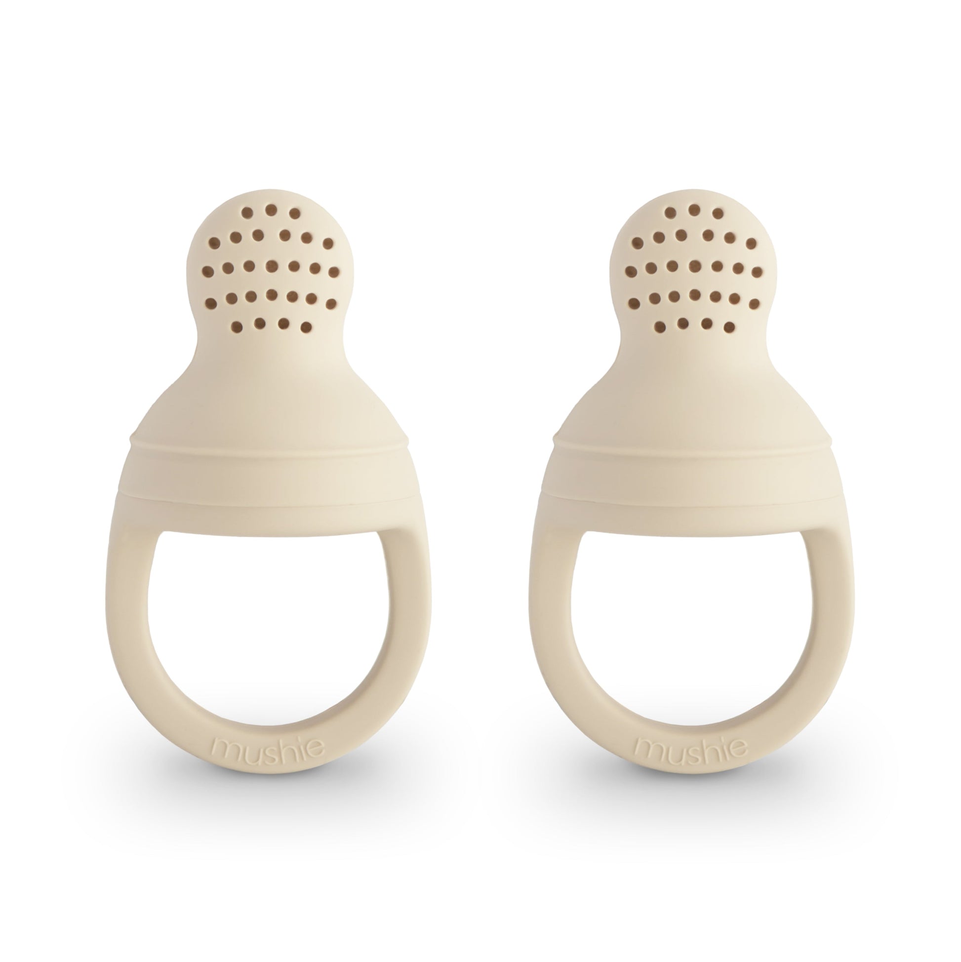 Two beige silicone teething rings on a white background