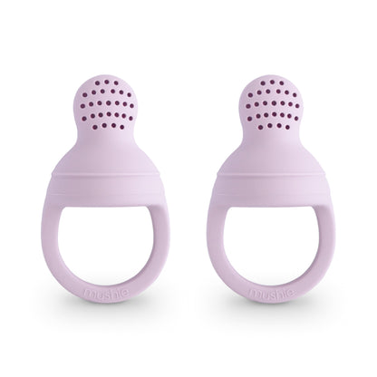 Two purple silicone teething rings on a white background