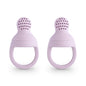 Two purple silicone teething rings on a white background