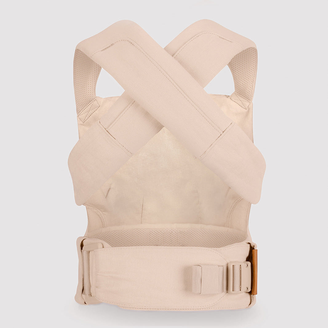Beige baby carrier on a light gray background