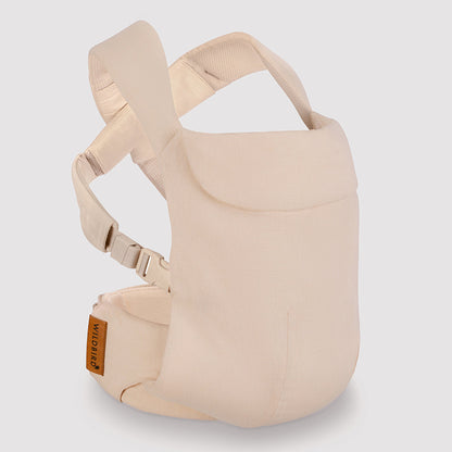 Beige baby carrier on a light gray background