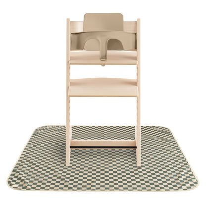 Wooden high chair with beige seat on a checkered mat