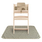 Wooden high chair with beige seat on a checkered mat