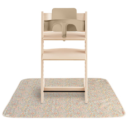 Beige high chair with a matching mat on a white background
