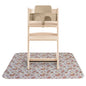 Wooden high chair with a floral-patterned mat on a white background