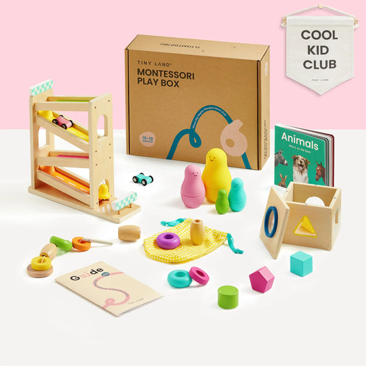 Collection of colorful Montessori toys and educational materials on a white surface with a pink background.