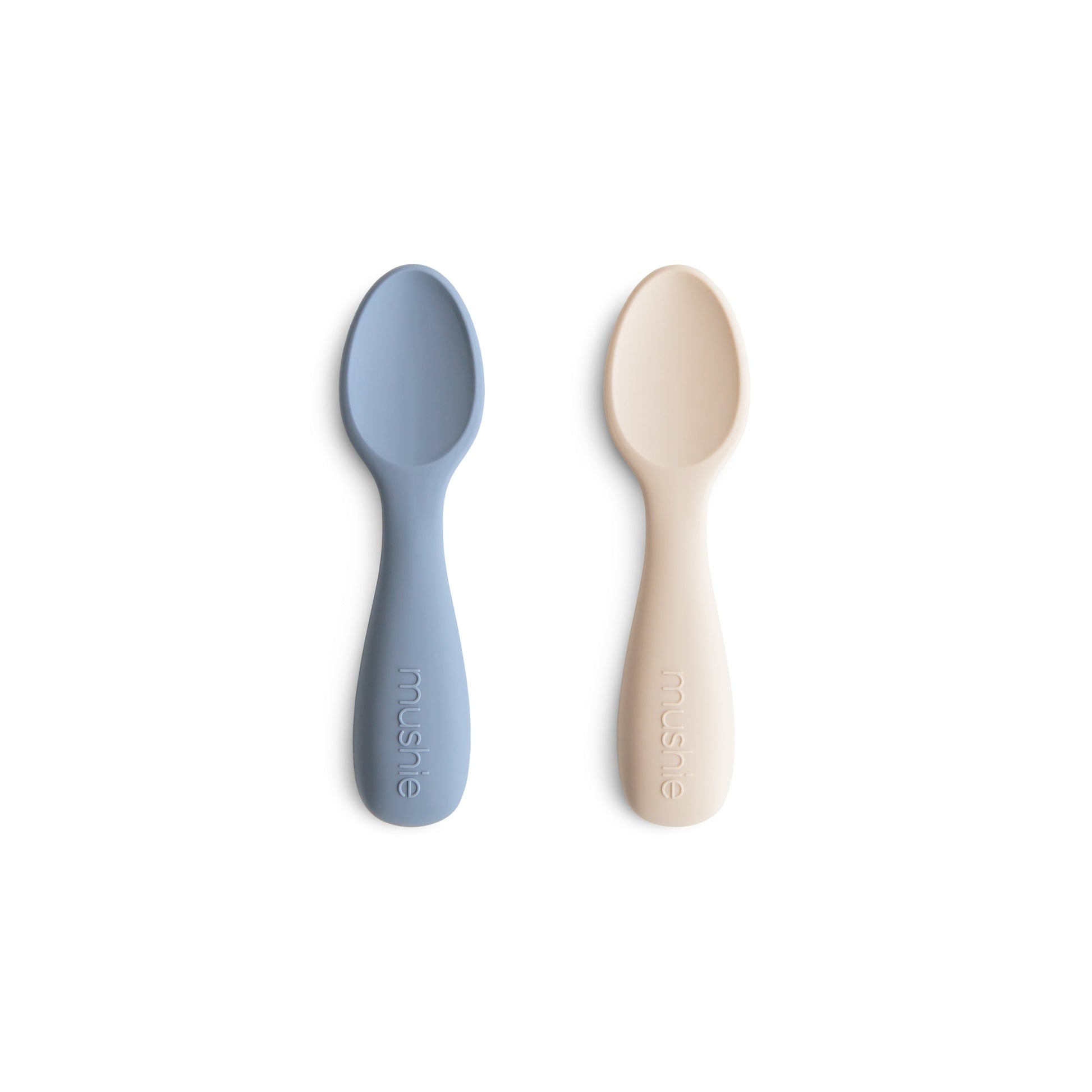 Two baby spoons, one blue and one beige, on a white background