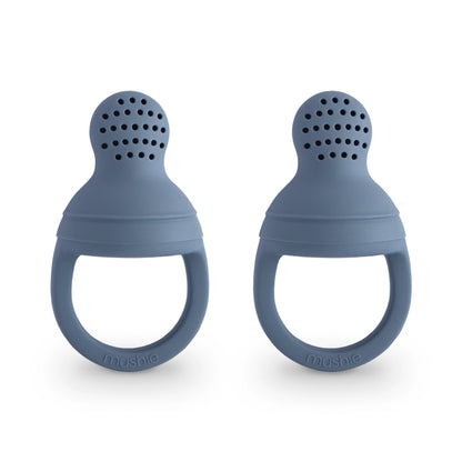 Two blue silicone baby teething rings on a white background