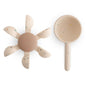 A silicone water wheel and cup on a white background.