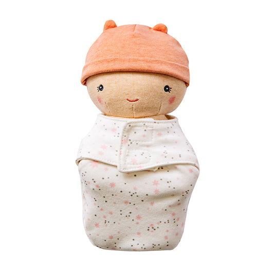 Baby doll wrapped in a swaddle with an orange hat on a white background