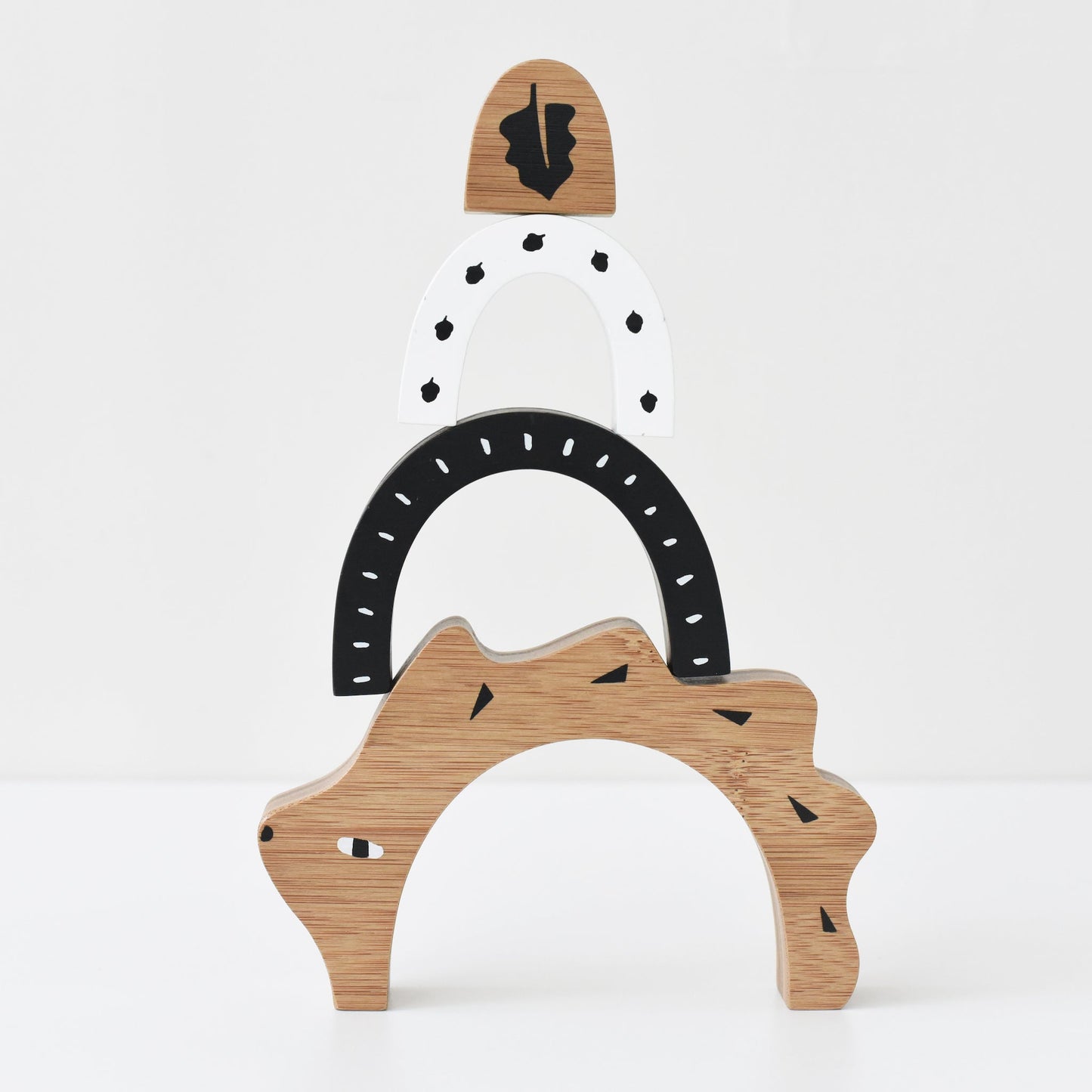 Wooden toy with a bear design on a white background