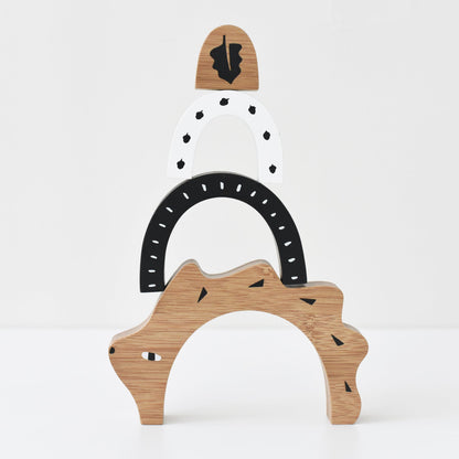 Wooden toy with a bear design on a white background