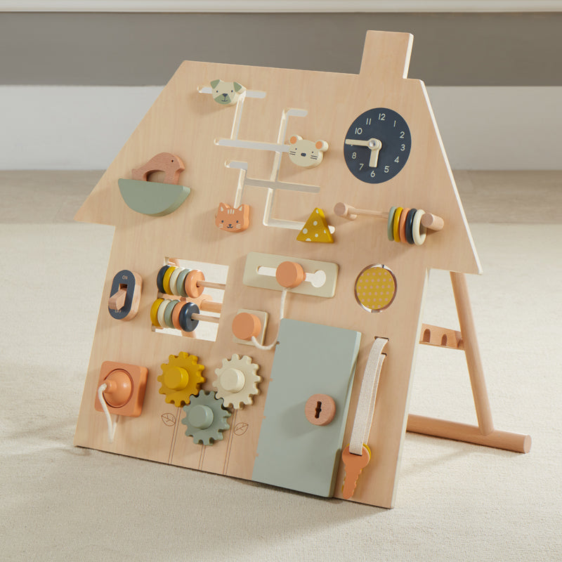 Wooden educational toy with various shapes and a clock on a neutral background