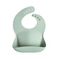 Mushie Silicone Baby Bib – Adjustable Catch-All