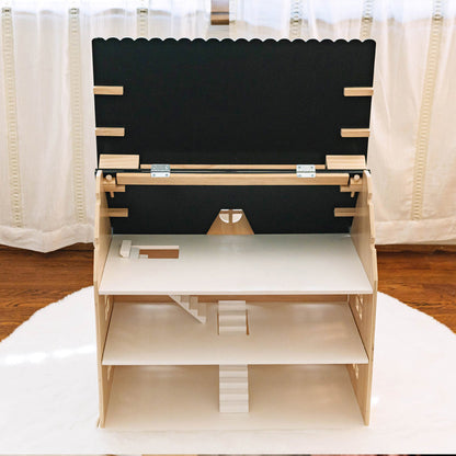 Wooden shelf with black backrest on a white surface